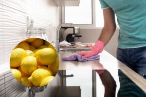 un signore che pulisce la cucina e dei limoni acconto